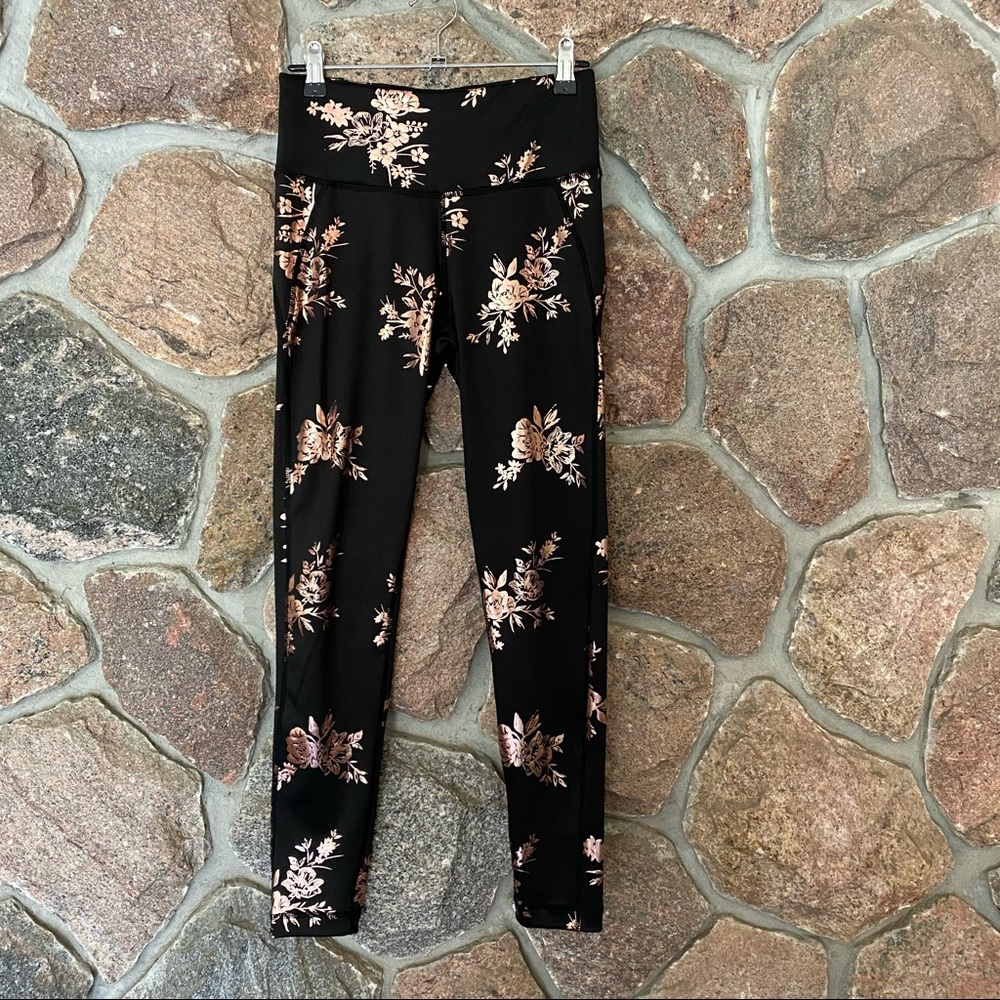 Black with gold floral athletic leggings.